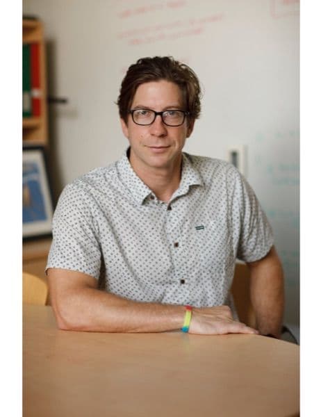 Portrait of Assoc Professor Gavin Rumbaugh