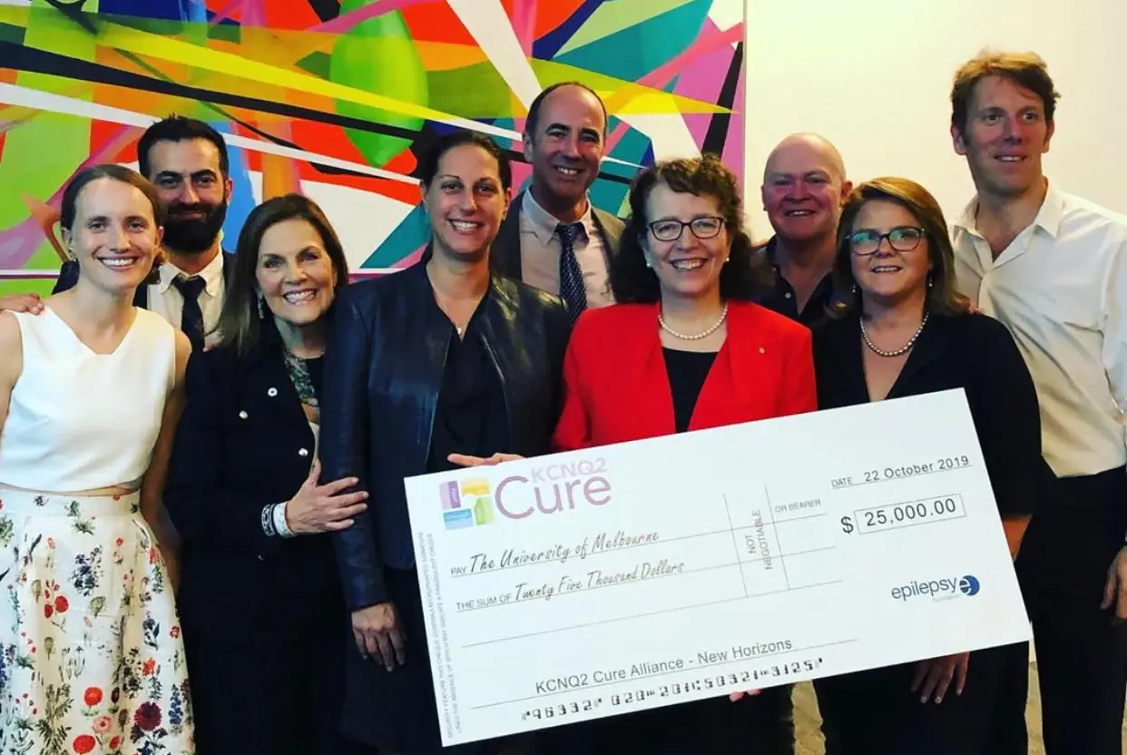 GETA parents and supporters presenting a KCNQ2 Cure Alliance cheque for $25,000 to the University of Melbourne in October 2019
